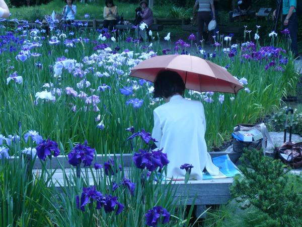 Lady painting the iris&#039;s